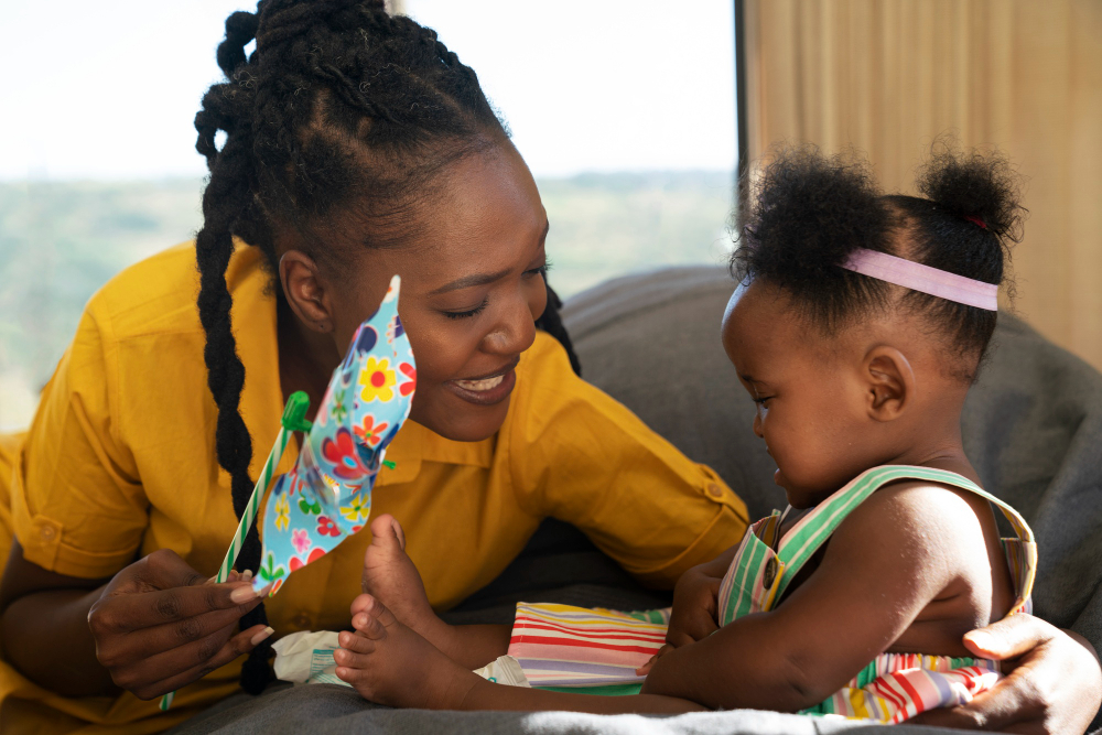 Parent and autistic child working together with educational materials on a table